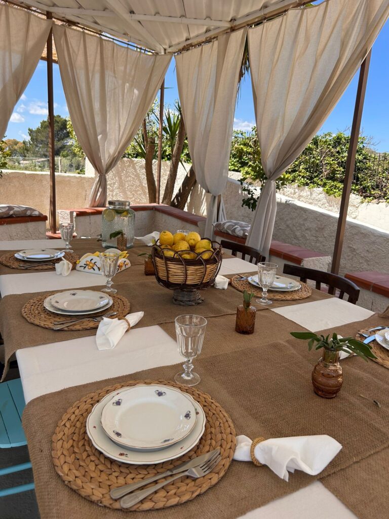 An outdoor table set in Sicily at Donna Nnni