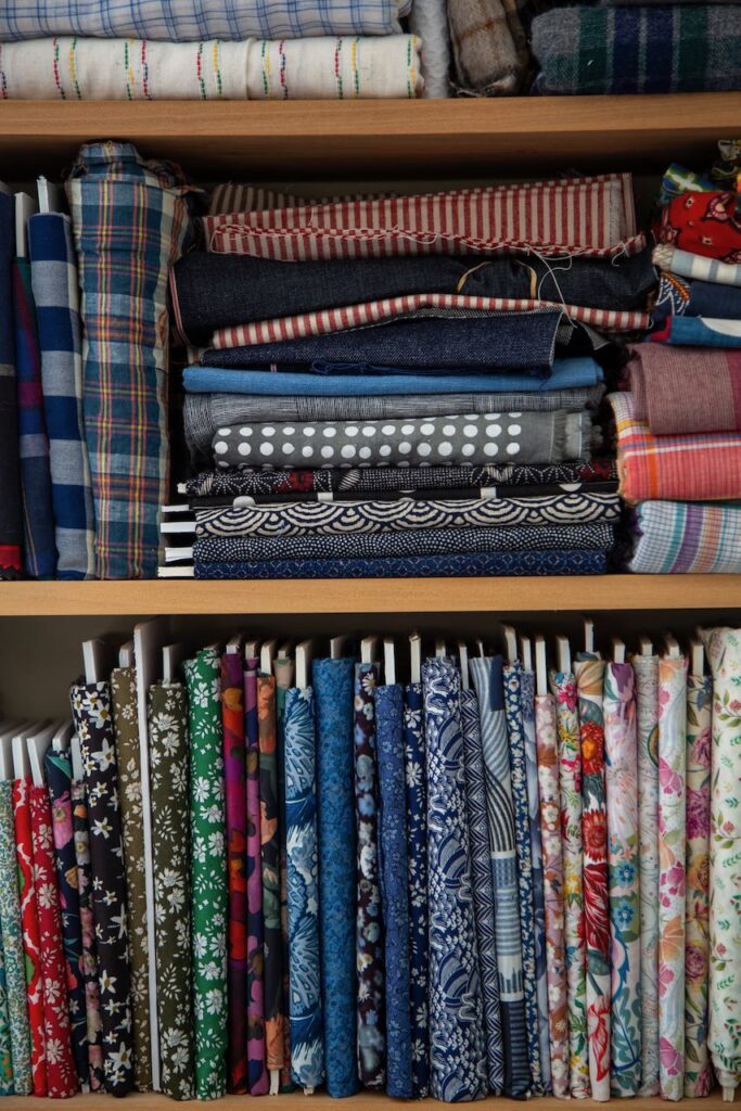 A storage wall of textiles